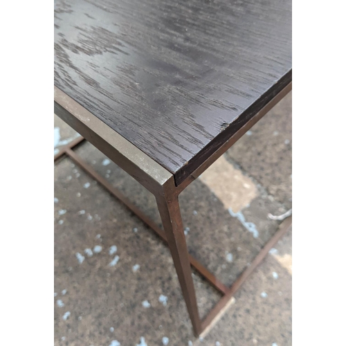 441 - NEST OF TABLES, ebonised ash veneered tops, bronze effect frames, graduated size, 50cm H x 55cm W x ... 