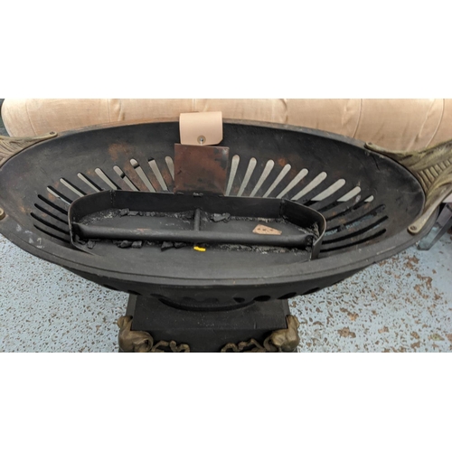 92 - URN FIRE GRATE, 68cm W x 50cm H with an oval shaped pierced basket on a plinth base decorated with r... 