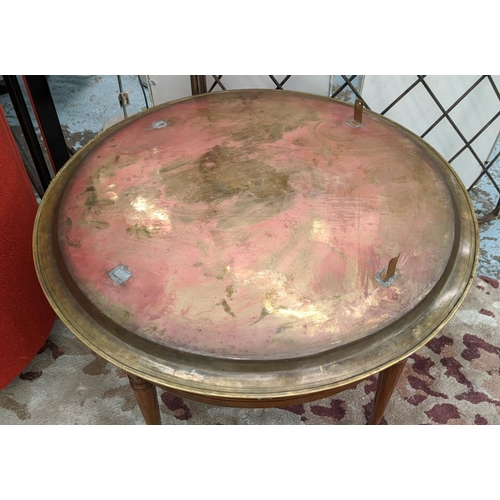 95 - CIRCULAR BRASS TRAY, 73cm diam x 53cm H decorated on a wooden stand.