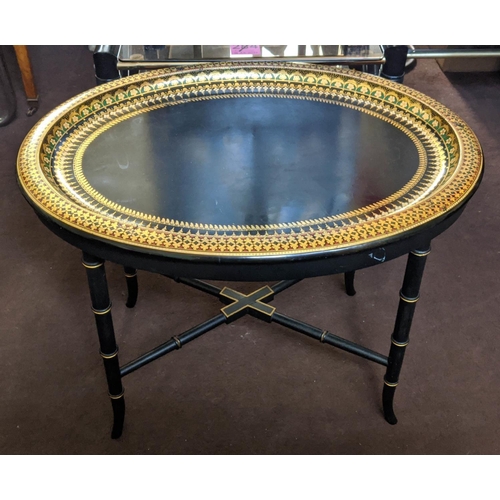 97 - BLACK JAPANNED TRAY, 63cm W x 48cm H x 47cm D Victorian papier mâché, oval and gilt decorated on a l... 