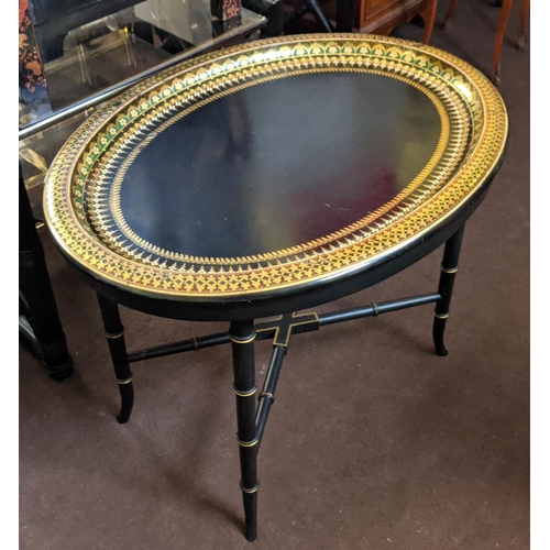 97 - BLACK JAPANNED TRAY, 63cm W x 48cm H x 47cm D Victorian papier mâché, oval and gilt decorated on a l... 