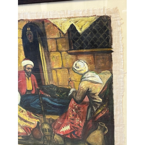 23 - 20TH CENTURY EGYPTIAN SCHOOL 'Carpet Weavers', oil on paper, 63cm x 94cm, framed.