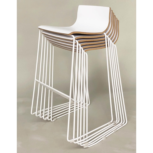 298 - BAR STOOLS, a set of six stacking with white seats and metals supports, 55cm w x 90cm H.