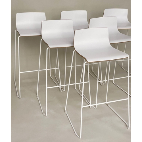 298 - BAR STOOLS, a set of six stacking with white seats and metals supports, 55cm w x 90cm H.