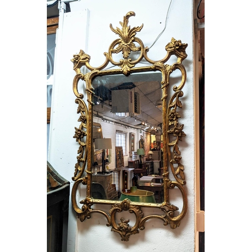 183 - WALL MIRROR, 106cm H x 58cm W, Italian reproduction giltwood frame in Chippendale manner.