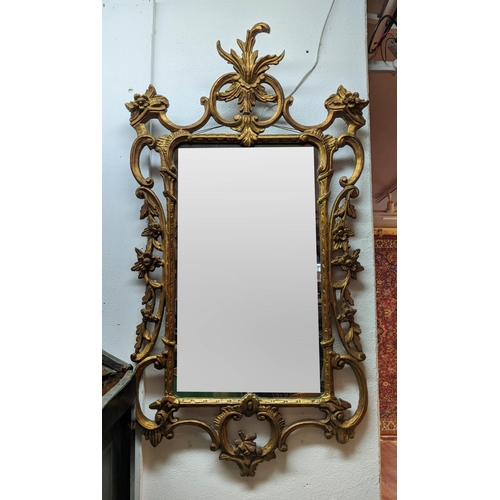 183 - WALL MIRROR, 106cm H x 58cm W, Italian reproduction giltwood frame in Chippendale manner.