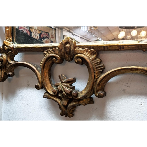 183 - WALL MIRROR, 106cm H x 58cm W, Italian reproduction giltwood frame in Chippendale manner.