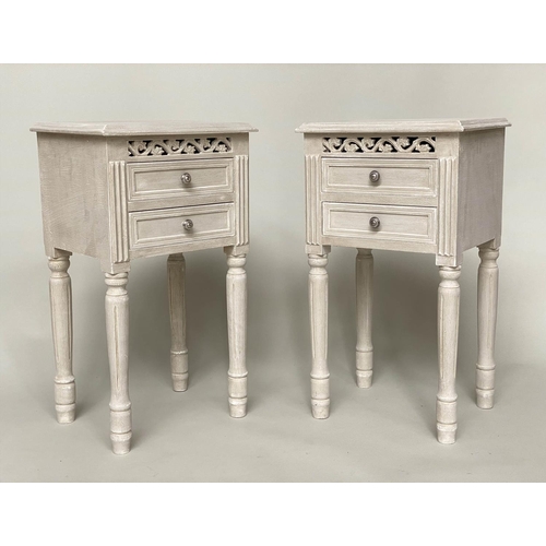 121 - BEDSIDE CHESTS, a pair, French style traditionally grey painted each with pierced frieze and two dra... 