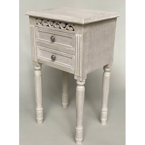 121 - BEDSIDE CHESTS, a pair, French style traditionally grey painted each with pierced frieze and two dra... 