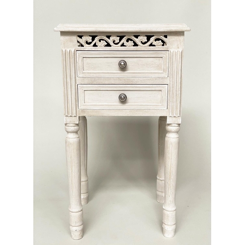 121 - BEDSIDE CHESTS, a pair, French style traditionally grey painted each with pierced frieze and two dra... 