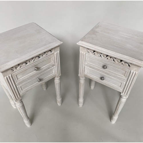 121 - BEDSIDE CHESTS, a pair, French style traditionally grey painted each with pierced frieze and two dra... 