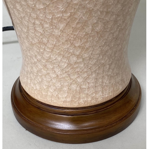 134 - TABLE LAMPS, a Chinese cream ceramic of baluster vase form with crackelure effect and silk style sha... 