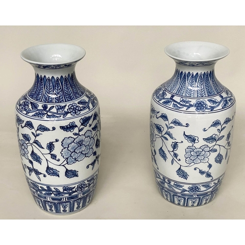 138 - TEMPLE VASES, a pair, Chinese blue and white ceramic peonies and fern collar, 45cm H. (2)