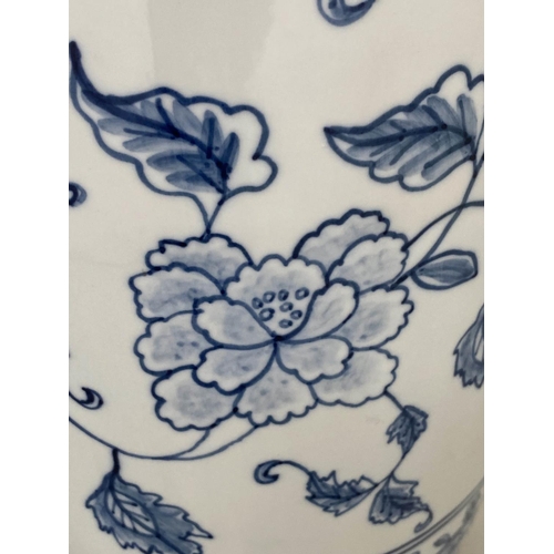 138 - TEMPLE VASES, a pair, Chinese blue and white ceramic peonies and fern collar, 45cm H. (2)