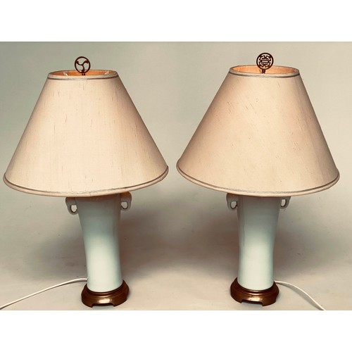 111 - TABLE LAMPS, a pair, Chinese style eau-de-nil ceramic, slender vase form with elephant head handles,... 