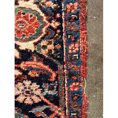 67 - ANTIQUE PERSIAN HERIZ CARPET, 314cm x 230cm.