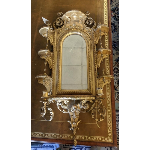 199 - WITHDRAWN - WALL MIRROR, 108cm H x 56cm, Victorian gilt with an arched bevelled plate and elaborate ... 