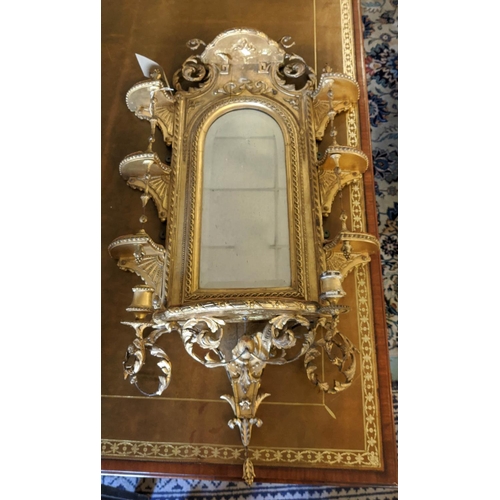 199 - WITHDRAWN - WALL MIRROR, 108cm H x 56cm, Victorian gilt with an arched bevelled plate and elaborate ... 