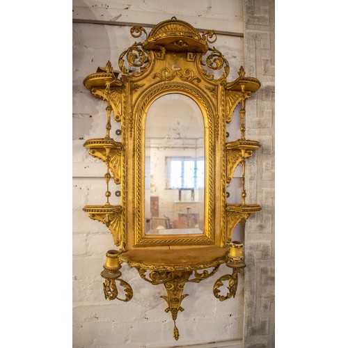 199 - WITHDRAWN - WALL MIRROR, 108cm H x 56cm, Victorian gilt with an arched bevelled plate and elaborate ... 