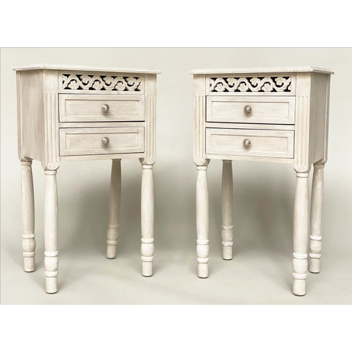 101 - BEDSIDE CHESTS/TABLES, a pair, French style grey painted each with pierced frieze and two drawers, 4... 