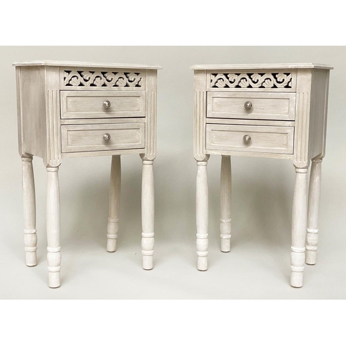 101 - BEDSIDE CHESTS/TABLES, a pair, French style grey painted each with pierced frieze and two drawers, 4... 