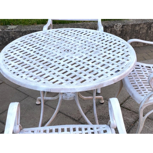 112 - GARDEN TABLE AND CHAIRS, painted cast aluminium lattice work with circular table and four armchairs,... 