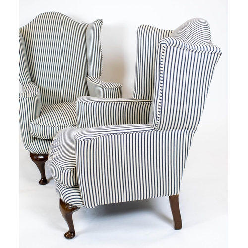 156 - WING ARMCHAIRS, 116cm H x 77cm W, a pair, Georgian style walnut in new ticking upholstery. (2)