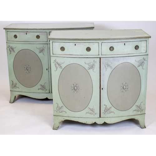 218 - BOWFRONT SIDE CABINETS, a near pair, Edwardian green and grey painted, each with two drawers above t... 