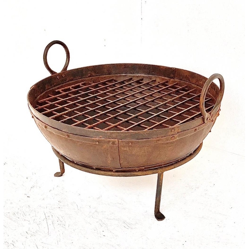 337 - INDIAN STYLE KADAI FIRE PIT, raised on stand, 47cm H x 64cm W x 60cm diam.