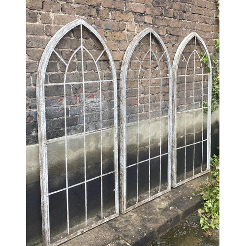 358 - GOTHIC STYLE WINDOW FRAMES, 160cm H x 67cm W, a set of three, distressed painted finish, metal frame... 