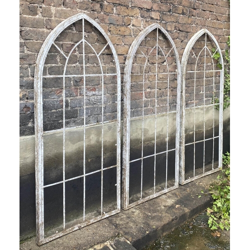 358 - GOTHIC STYLE WINDOW FRAMES, 160cm H x 67cm W, a set of three, distressed painted finish, metal frame... 