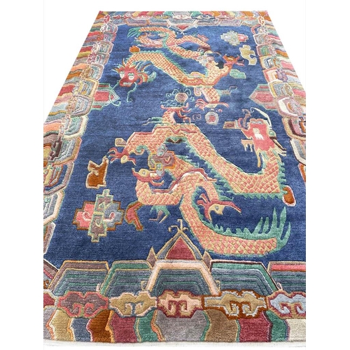 63 - VINTAGE TIBET DRAGON CARPET, 300cm x 180cm.