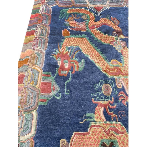 63 - VINTAGE TIBET DRAGON CARPET, 300cm x 180cm.