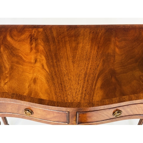 93 - HALL TABLE, George III style flame mahogany of serpentine outline with frieze drawer and tapering su... 