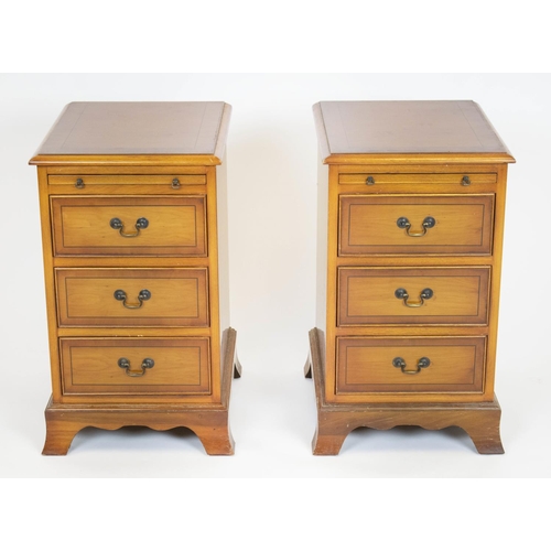 223 - BEDSIDE CHESTS, 61cm H x 38cm x 43cm, a pair, Georgian style yewwood, each with slide above three dr... 