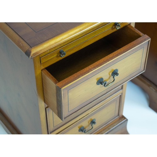 223 - BEDSIDE CHESTS, 61cm H x 38cm x 43cm, a pair, Georgian style yewwood, each with slide above three dr... 