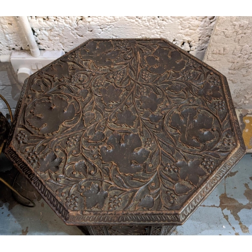 224 - OCCASIONAL TABLE, Anglo-Indian octagonal form, foliage carved top and pierced folding base, 49cm H x... 