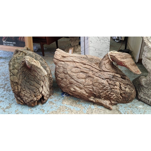 207 - CARVED SWANS, a pair, each approx 68cm L x 41cm H, in a distressed finish. (2)