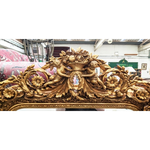 372 - BAROQUE STYLE GILT FRAME WALL MIRROR, cherub and flower moulded crest, bevelled edge glass, 157cm H ... 