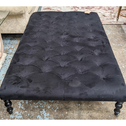 415 - LARGE FOOTSTOOL, deep buttoned navy blue upholstery, raised on ebonised ash turned legs with castor ... 