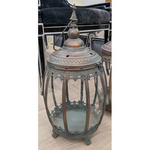 418 - HANGING LANTERNS, set of three, antiqued copper finish, barrel form, glazed sides, 46cm H x 25cm dia... 