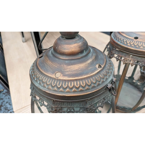 418 - HANGING LANTERNS, set of three, antiqued copper finish, barrel form, glazed sides, 46cm H x 25cm dia... 