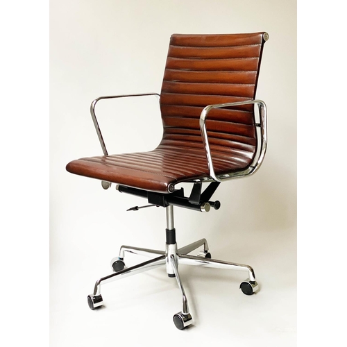 109 - REVOLVING DESK CHAIR, Charles and Ray Eames inspired with ribbed tan leather seat revolving and recl... 