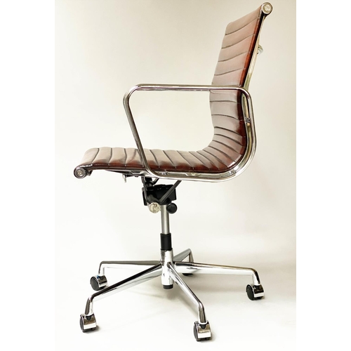 109 - REVOLVING DESK CHAIR, Charles and Ray Eames inspired with ribbed tan leather seat revolving and recl... 