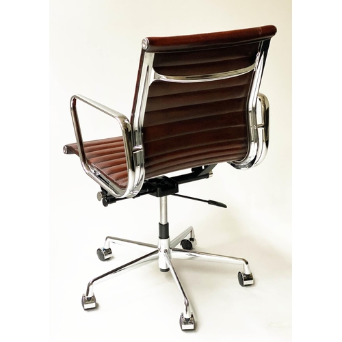 109 - REVOLVING DESK CHAIR, Charles and Ray Eames inspired with ribbed tan leather seat revolving and recl... 