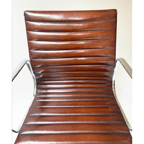 109 - REVOLVING DESK CHAIR, Charles and Ray Eames inspired with ribbed tan leather seat revolving and recl... 