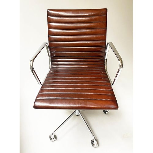 109 - REVOLVING DESK CHAIR, Charles and Ray Eames inspired with ribbed tan leather seat revolving and recl... 