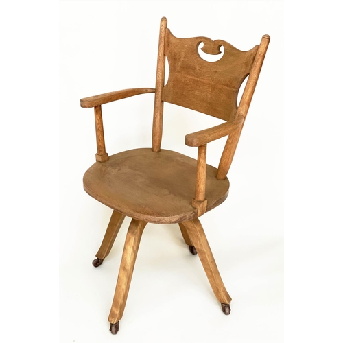 113 - DESK CHAIR, English 1930s oak with pierced back and revolving solid elm seat, 54cm W.