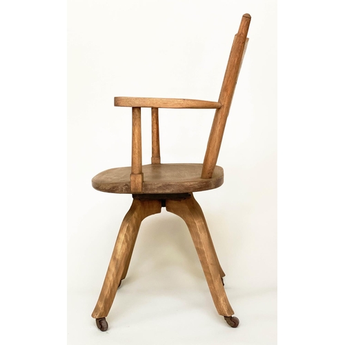 113 - DESK CHAIR, English 1930s oak with pierced back and revolving solid elm seat, 54cm W.