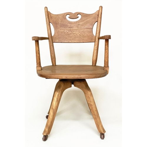 113 - DESK CHAIR, English 1930s oak with pierced back and revolving solid elm seat, 54cm W.